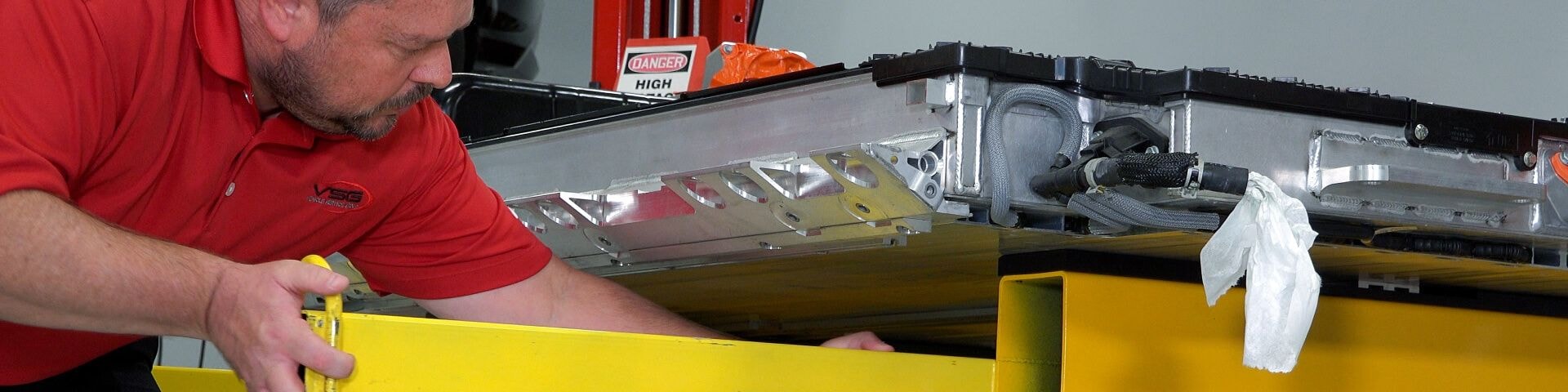 Man working on industrial printer lift table