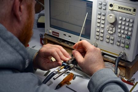 Man working on electronic connection