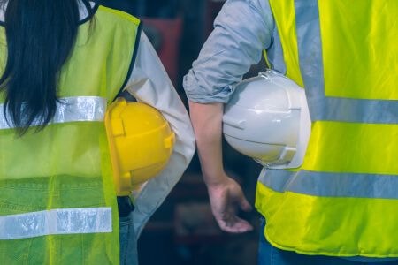 Two workers standing next to each other